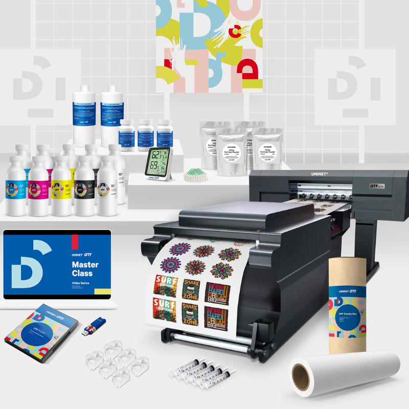 Digital printing setup with printer, ink bottles, and printed materials on a white background.